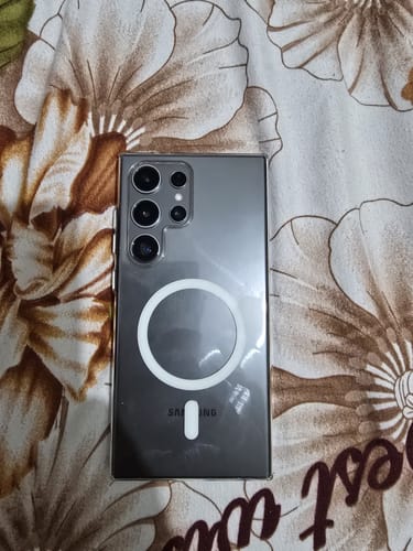 Reviewer's Anti Yellow Magsafe Clear Case on a grey Samsung Galaxy S24 Ultra, showing the white magnetic ring on the back.