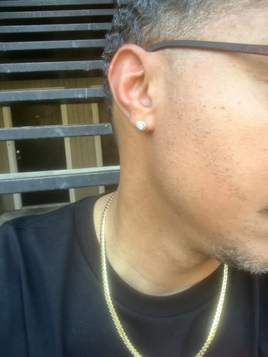 Close-up of a reviewer wearing the sparkling Cluster Halo Diamond Earring in their ear.