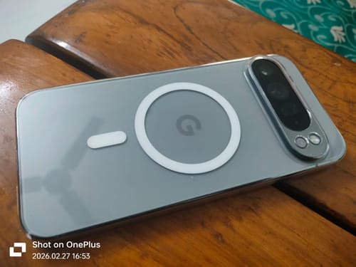 Customer's Anti Yellow Magsafe Clear Transparent Case on a grey Google Pixel phone, shown on a wooden surface.