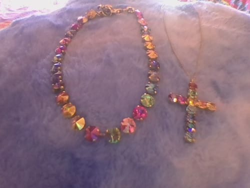 Reviewer's Tova Donatella Necklace shown separated into a colorful crystal necklace and the matching cross pendant.