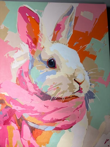 Customer's completed Pastel bunny paint-by-number painting, showing a colorful rabbit wearing a bright pink scarf.