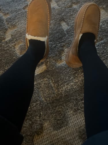 Reviewer showing their legs wearing the black Performance Eucalyptus Compression Socks.