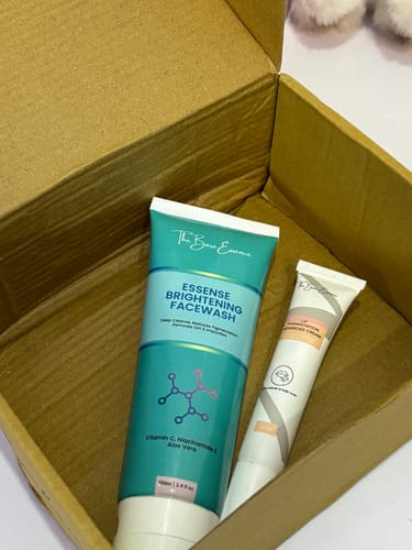 Customer's Lip Pigmentation & Facewash bundle, with the facewash and cream tubes resting in an open cardboard box.