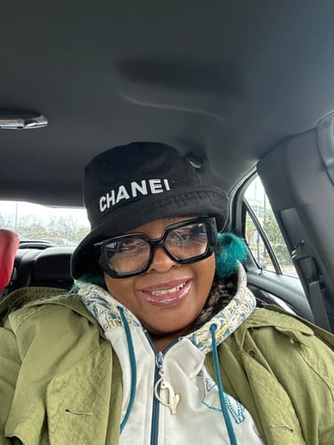 Reviewer smiles for a selfie in a car, happy with their Body Magic Chlorophyll Pill.