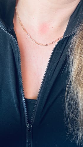 Reviewer wearing the Tammy paperclip chain necklace. The delicate gold-toned chain lays flat against their neck.