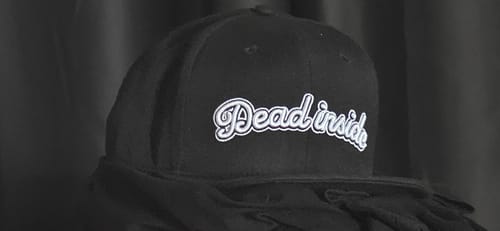 Customer's black Dead Inside Snapback showing the white embroidered logo.