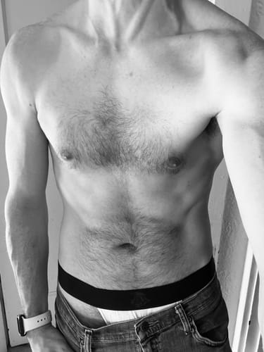 Reviewer photo shows the Nylon Mesh Thong with a black waistband and white pouch under jeans.