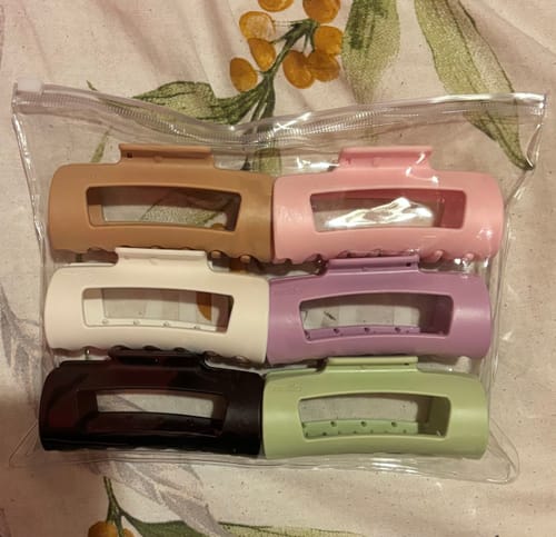 Customer's six new cloud clips in assorted colors, displayed in their original clear zippered pouch.
