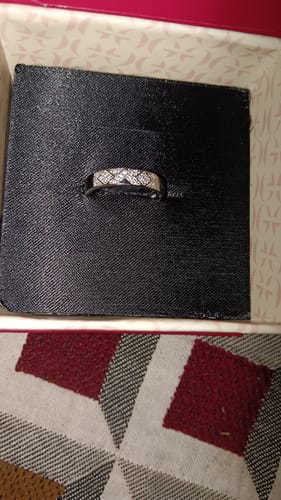 Customer's Silver Modern Minimalism Ring with a sparkling geometric pattern, displayed inside its black jewelry box.