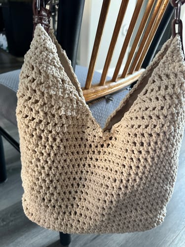Close-up of a customer's completed beige Haven Hobo bag, showing the detailed crochet stitch work.