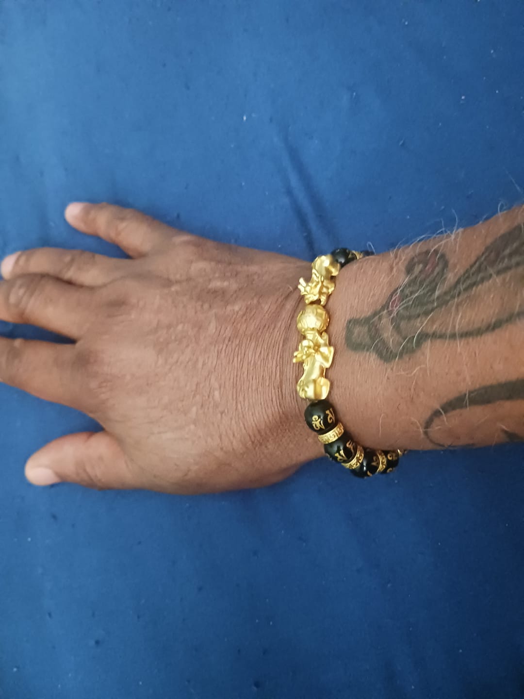 Customer photo review of Fortune Giving Double Gold Pixiu Bracelet