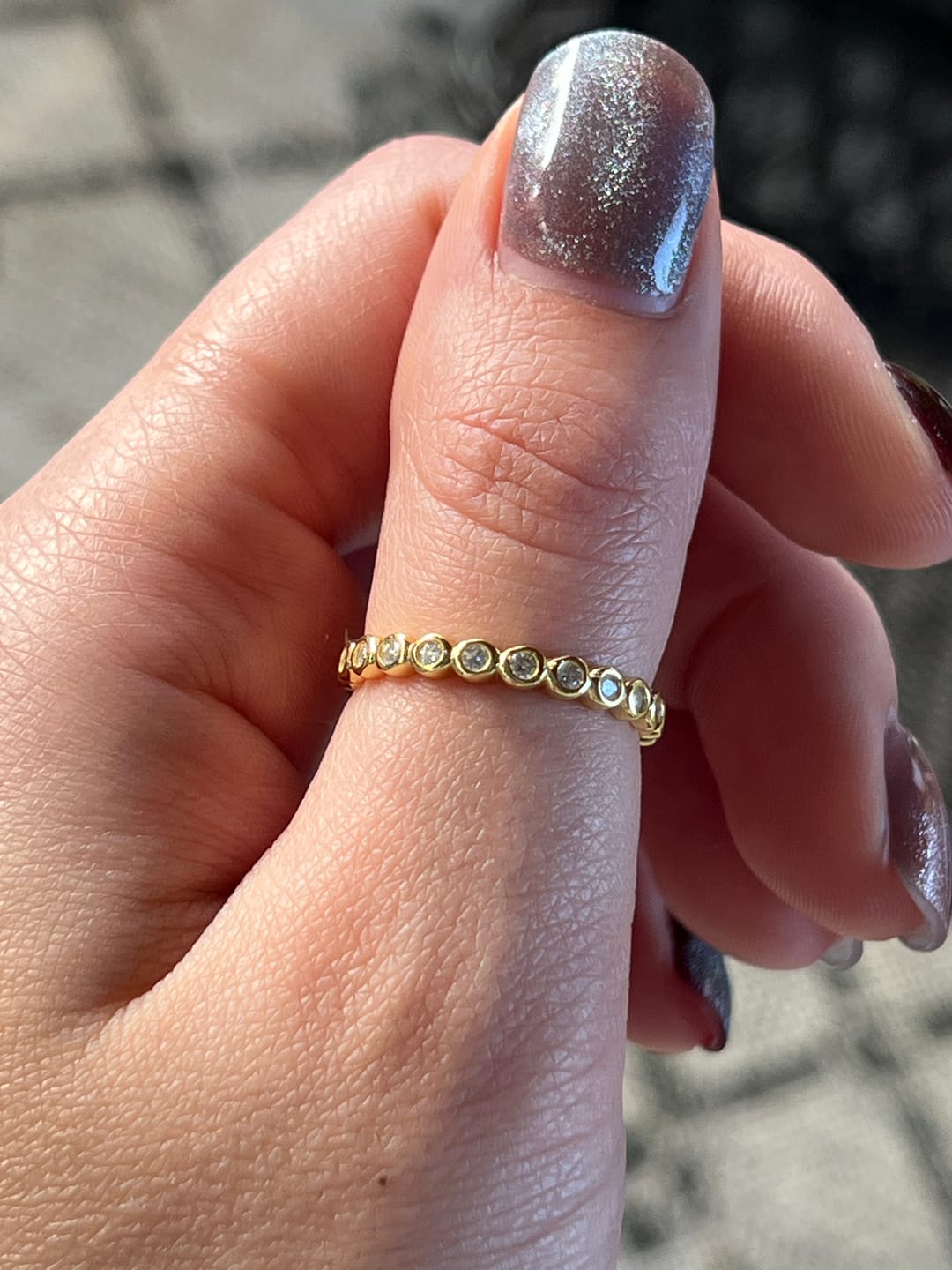 Customer photo review of 3mm Moissanite Round Cut Bezel Eternity Ring