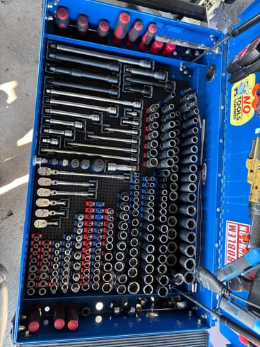 Customer's open toolbox drawer with sockets and extensions neatly organized using Toolgrid® Socket Holder Clips.