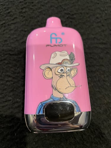 Kunde zeigt die pinke RANDM DIGITAL BOX 12000 Vape mit einer auffälligen Cartoon-Affen-Grafik.