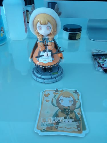 Customer's 'Deer Girl' figure from the Kokoya Breeze blind box series, displayed on a desk with its matching character card.