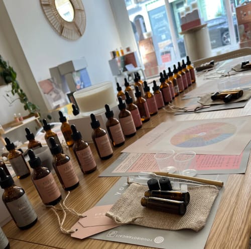 Reviewer photo of a station at the Perfume Making Workshop, neatly set with essential oils and tools.