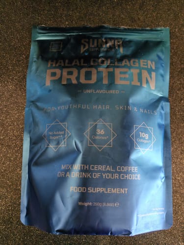 Customer's blue pouch of Halal Collagen Protein, an unflavoured food supplement, resting on a dark surface.