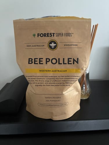 Customer's bag of West Australian Bee Pollen from Forest Super Foods, shown on a dark surface.