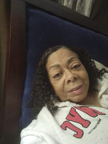 Reviewer smiles, showing her soft, defined curls after using the SET Gel-To-Foam Styling Mousse.