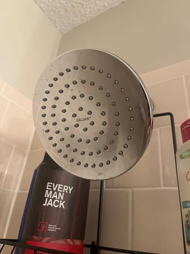 Customer's Gillian metal shower head installed in a tiled shower, showing the large spray face.