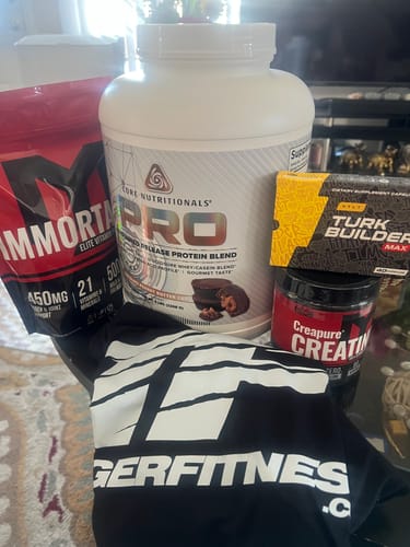 Customer's supplement order featuring the red Immortal® Elite Multi-Vitamin Pack pouch alongside other products.