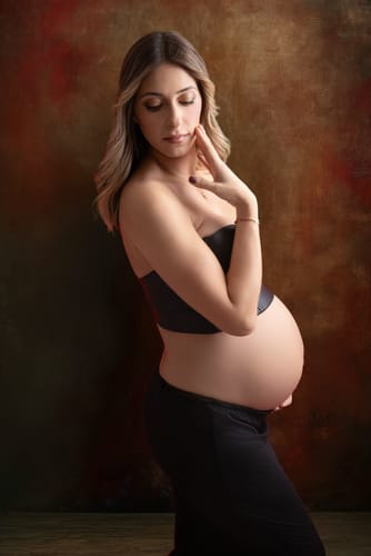 Customer's maternity photo edited with a rich, artistic background from the Texture Vault Bundle.