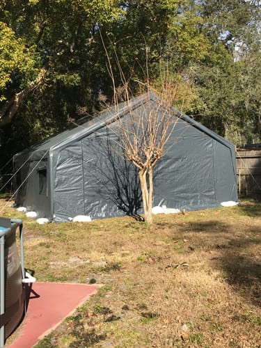 Customer photo review of REIBII 20x20 Heavy-Duty Carports for Two Car, Portable Carport Garage with 4 Windows and 3 Roll-up Doors, Waterproof Carport Canopy Protection UV50+