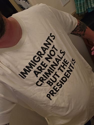 Customer photo review of Immigrants Premium Unisex T-Shirt
