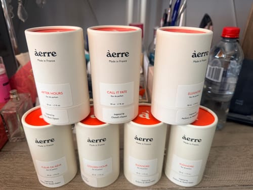 Customer's collection of àerre fragrances, featuring the Fleur de Rêve perfume box in the front row.