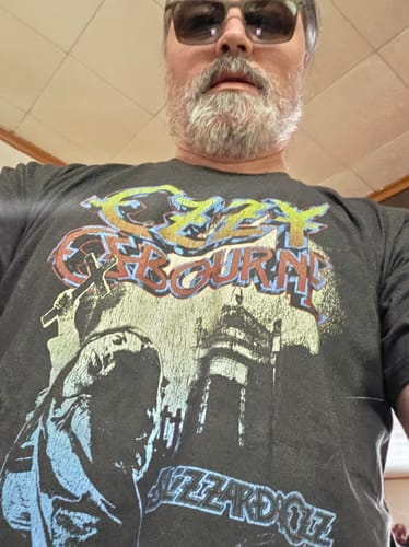 Reviewer wearing the dark graphic Blizzard of Ozz Ozzy Osbourne T-Shirt.