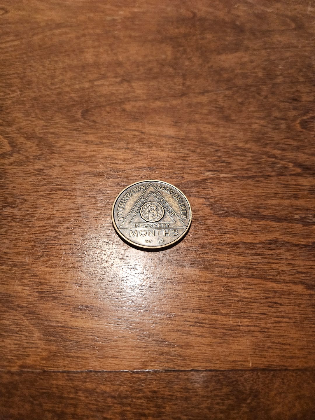 Customer photo review of 1 to 50 Year Bronze AA Meeting Chips - Sobriety Mint Infinity Triangle Recovery Medallions/Coins