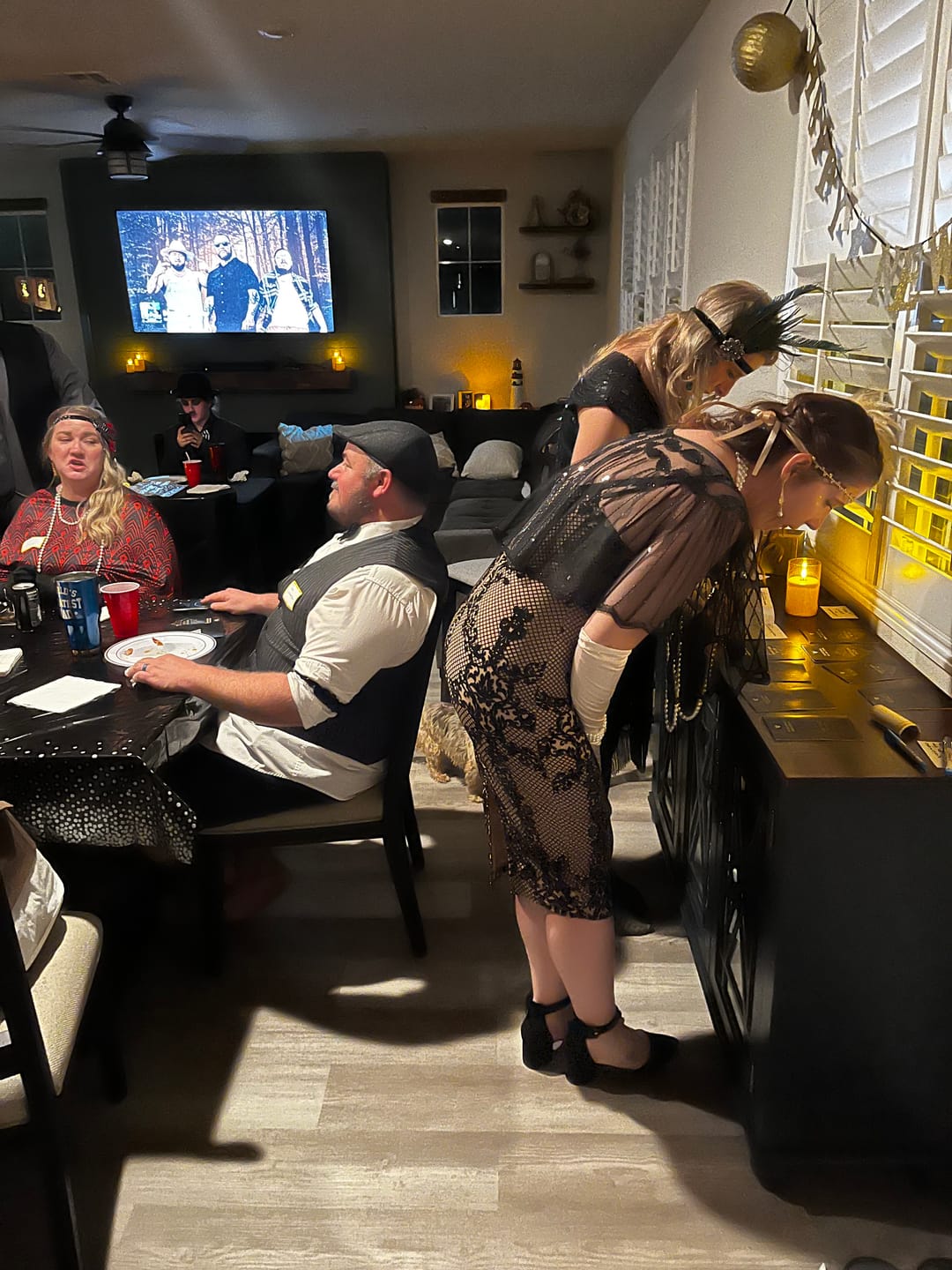 Customer photo review of Replay-able 1920s Murder Mystery Dinner Party Game for Up to 20 Adults - Host Your Own Dinner Party Game Night - 1920s Speakeasy Gatsby Theme - 1920s Fancy Dress Dinner Party(V2)