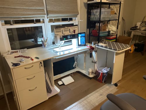 Customer's white Sydney XL Sewing Cabinet, fully extended with a large sewing machine in a home sewing room.