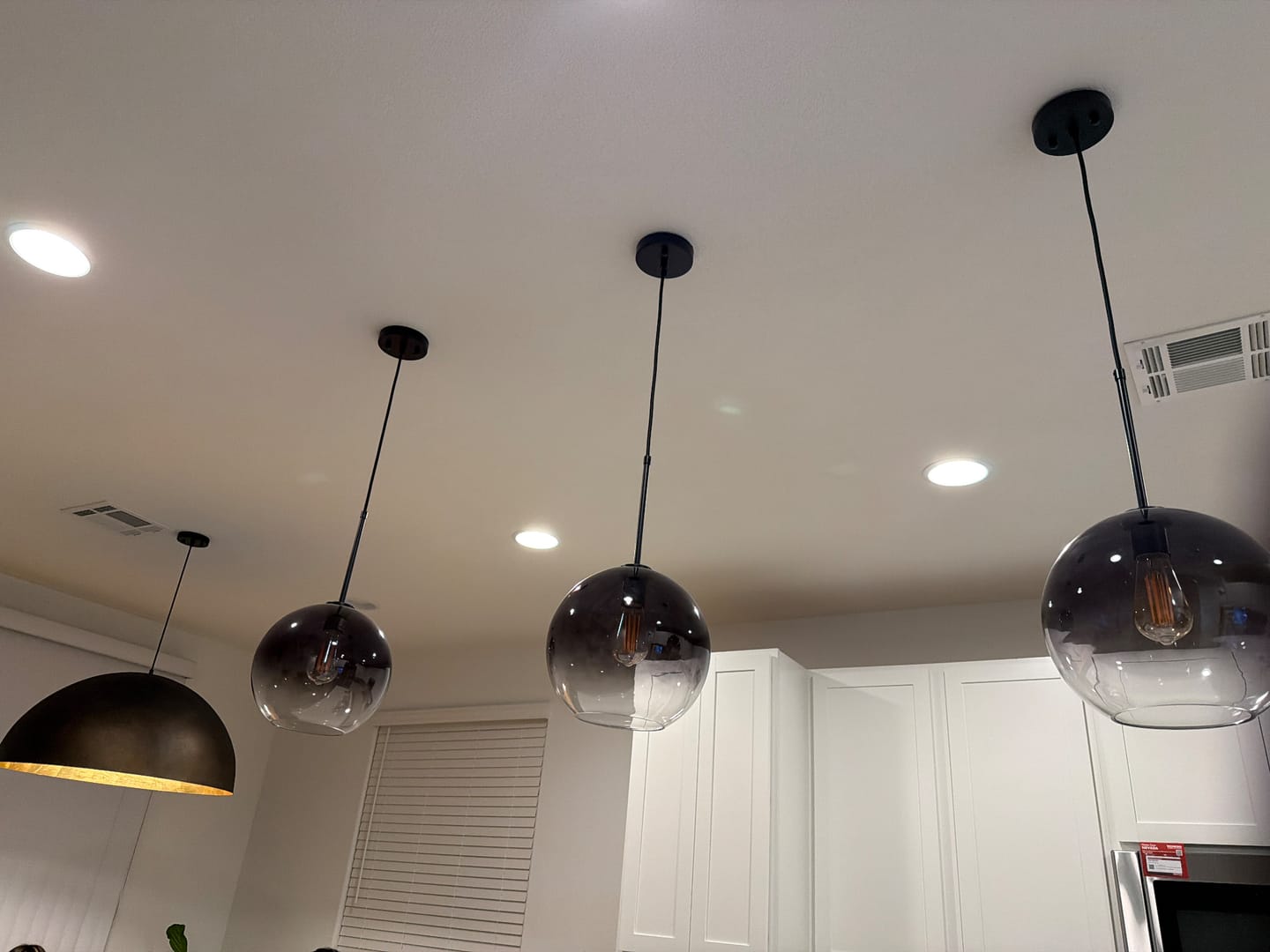 Customer photo review of Modern Minimalist 1-light Smoked Grey Tinted Glass Globe Pendant