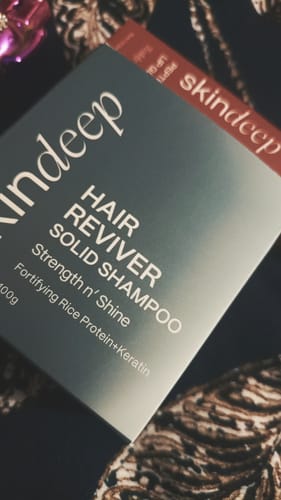 Customer's close-up photo of the HAIR REVIVER SOLID SHAMPOO box after it arrived.