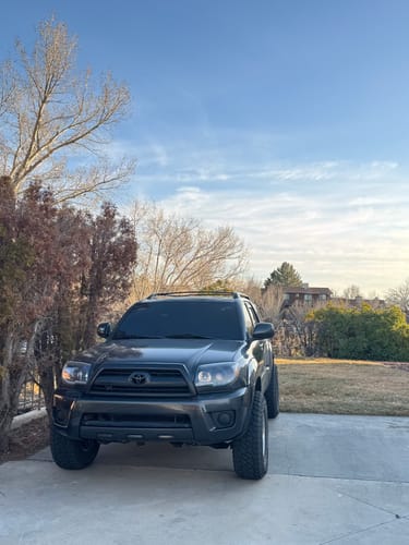 A customer's dark gray Toyota 4Runner with 2-inch wheel spacers installed, showing a wider stance.