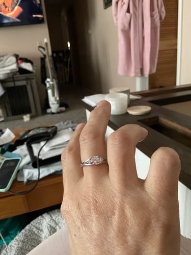 Customer photo review of Three Stone Round Moissanite And Trillion Accents Engagement Ring