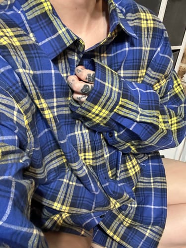 Reviewer showing the fit of their soft, oversized Royal Blue and Yellow Flannel Shirt.