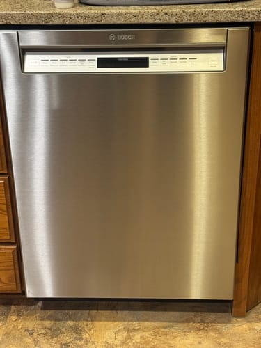Customer's shiny stainless steel dishwasher after using the Stainless Steel Polish to remove streaks.