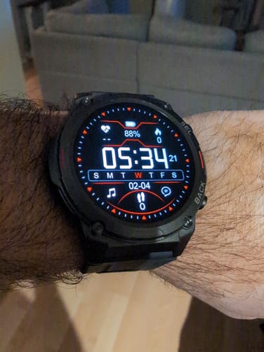 Customer wearing the Gard Pro Ultra 2+ watch, showing its large, bright digital display with health stats on their wrist.