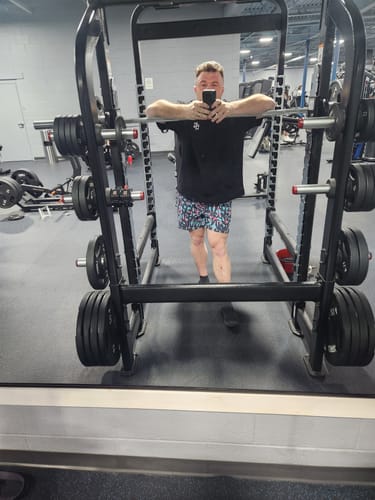 Reviewer at the gym wearing the colorful, patterned V1 Lined Training Shorts.