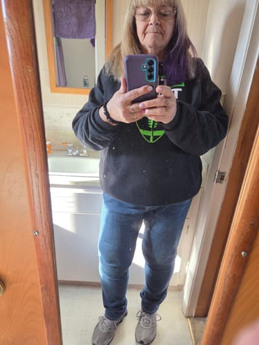 Reviewer taking a full-body mirror selfie, showing her physique after using Keto Activate.