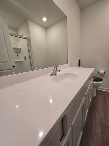 Reviewer's sparkling white bathroom vanity after cleaning with the Bathroom Concentrate 4x.