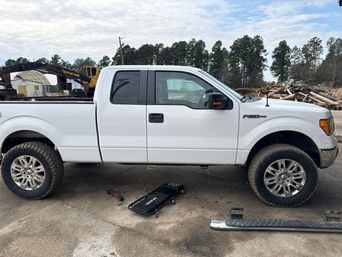 Customer's white Ford F150 looking level after installing the 3" front and 2" rear leveling lift kit.