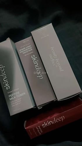 Reviewer's Dream Glaze Peptide Milk Toner box shown with a Bakuchiol Serum and Peptide Lip Glaze.