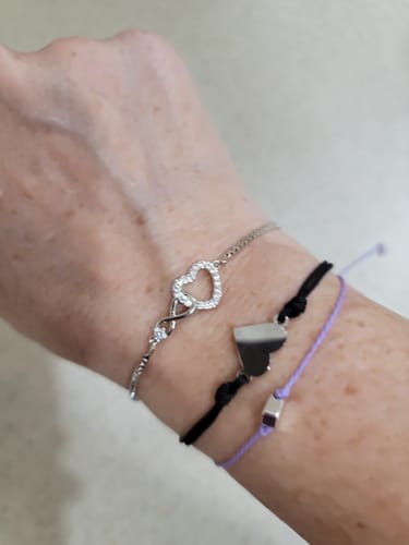 Customer's photo of the Forever Love Bracelet on a wrist, showing the sparkling heart and infinity symbol design.