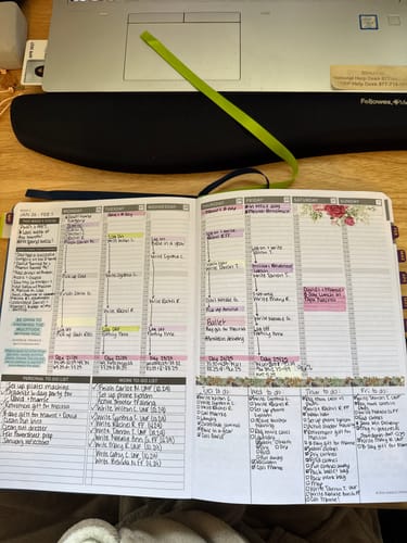 Customer's Weekly 2026 Planner open to a filled-out weekly spread with handwritten notes, highlights, and washi tape.