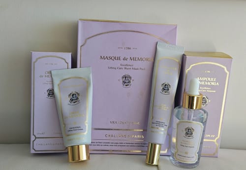 Customer's MEMORIA COMPLETE PROGRAM products, including an ampoule and creams, arranged with their light purple and gold packaging.