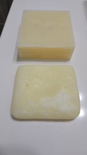 Customer compares a new Tallowed Truth Bar with a used bar to show its size after one month.