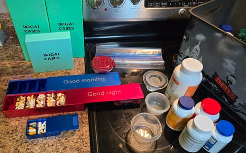 Reviewer shows their new 3-Pack Bundle of metal pill cases, which replace old plastic bottles and bags.